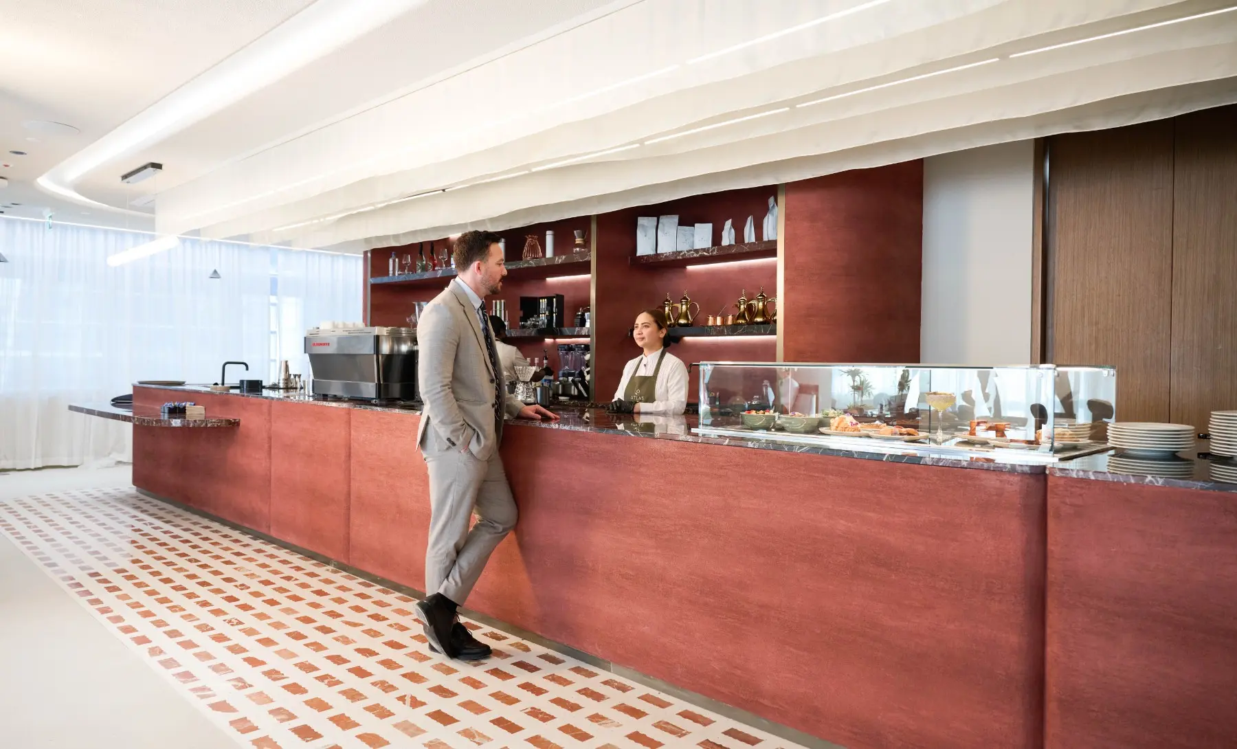 A business professional ordering coffee at the café in KAFD 2.08, Riyadh