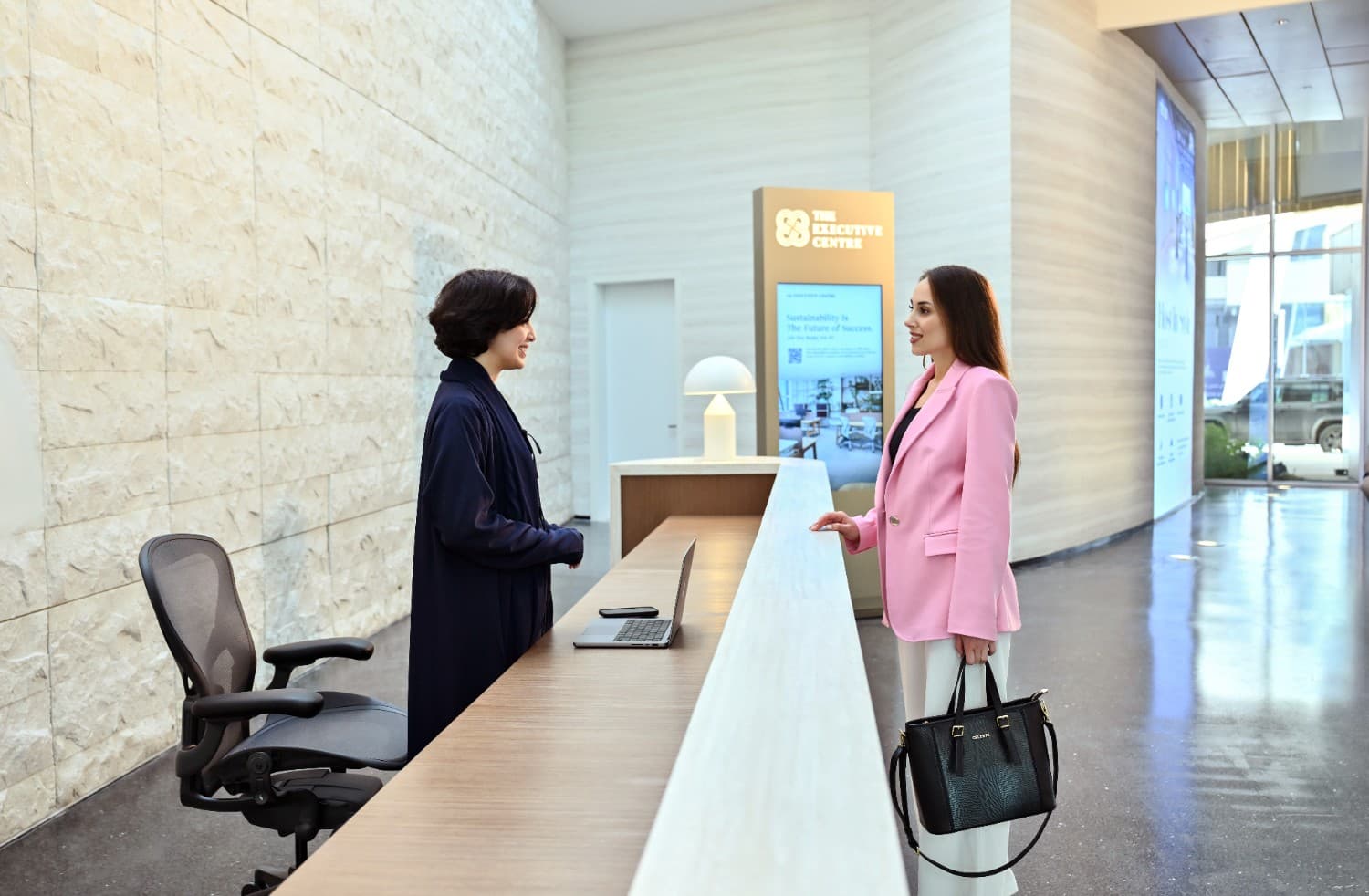 The Reception area at The Executive Centre KAFD 2.08, featuring a modern design and reception desk