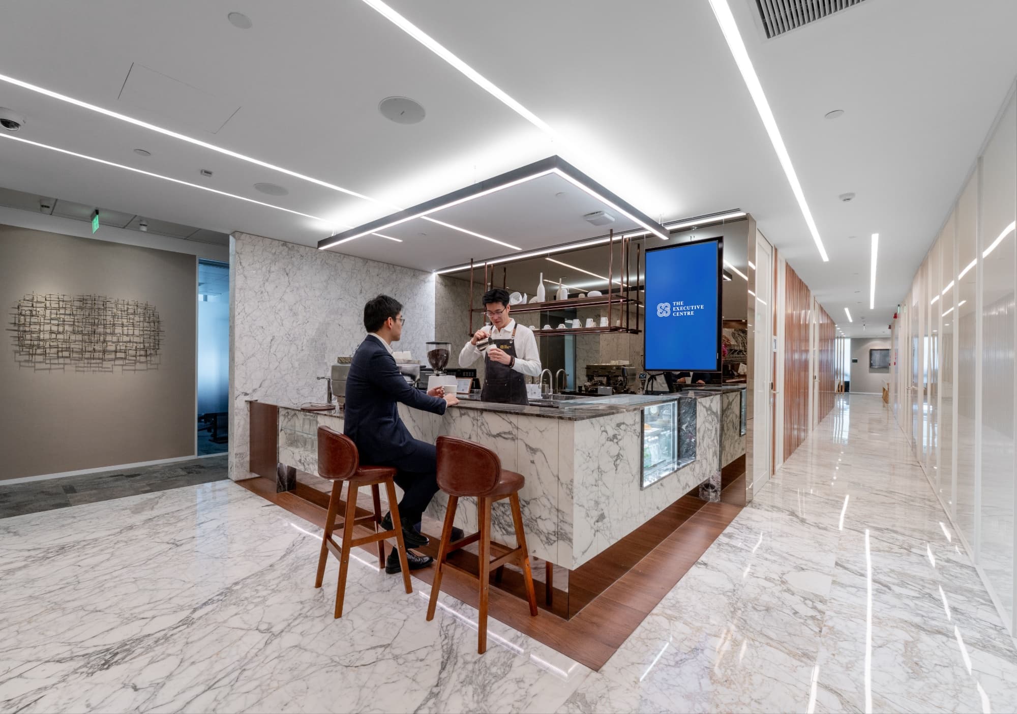Barista preparing coffee at The Executive Centre Shanghai HKRI 1 bar in Shanghai premium coworking space