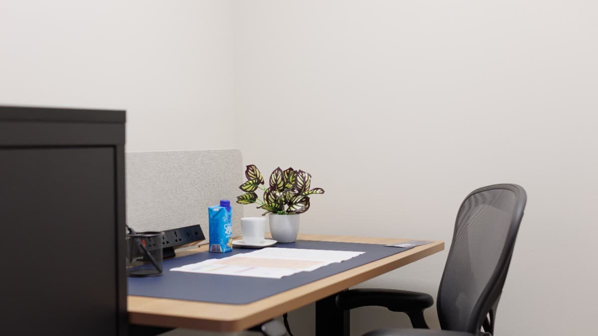 A Private Office in Frasers Tower, Singapore, featuring modern furnishings and a professional workspace