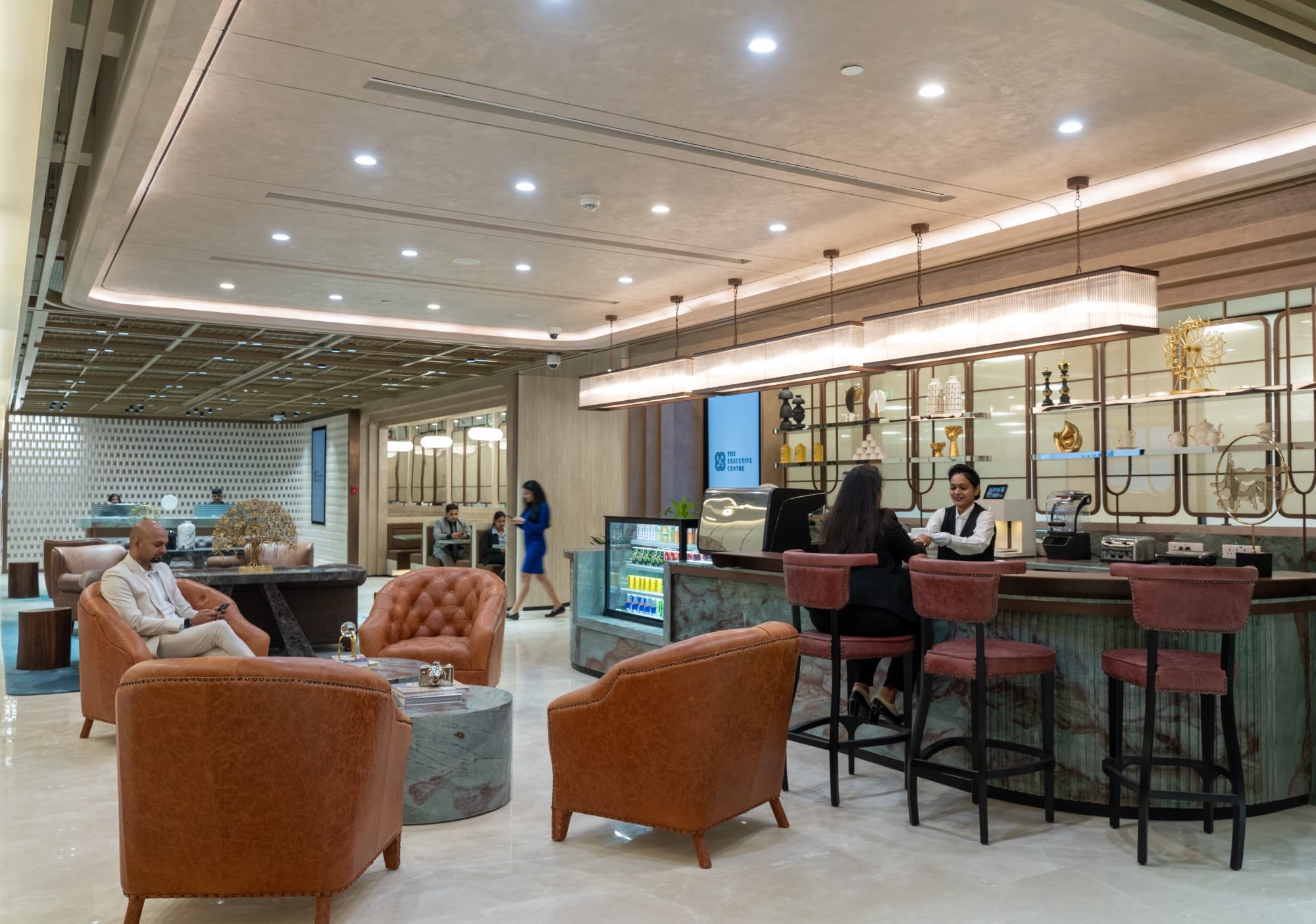The Barista Lounge area and reception at The Earth Centre in Bangalore, featuring comfortable seating and a welcoming atmosphere